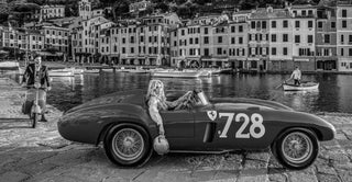Photographer David Yarrow applies the 70/30 rule photography with this image of a woman in a sports car against a backdrop of houses in, The Italians (2026).