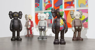 A collection of assorted 4 foot KAWS Companion figures exhibit in a gallery space, as collectors wonder, ‘Are KAWS figures a good investment?”.