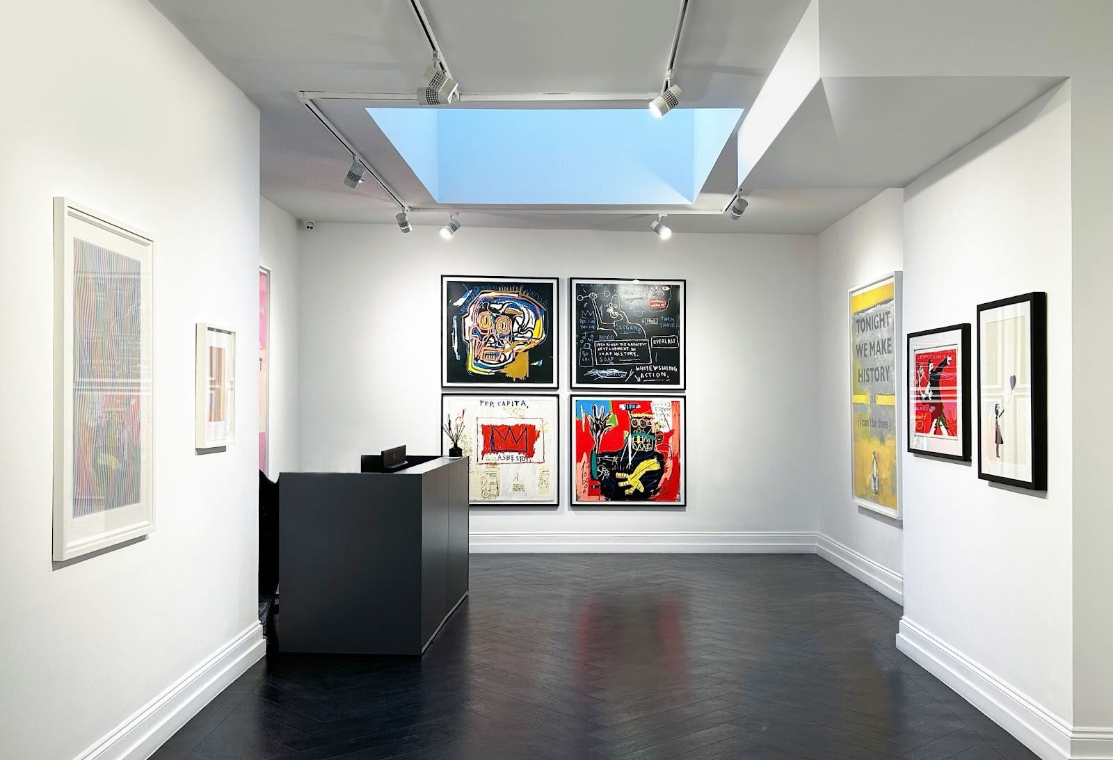 Maddox Gallery, an expert at buying and selling limited edition prints, displays Jean-Michel Basquiat&rsquo;s Head; Rinso; Per Capita; and Ernok (1983/2001), Edition of 15, in their gallery space in London.