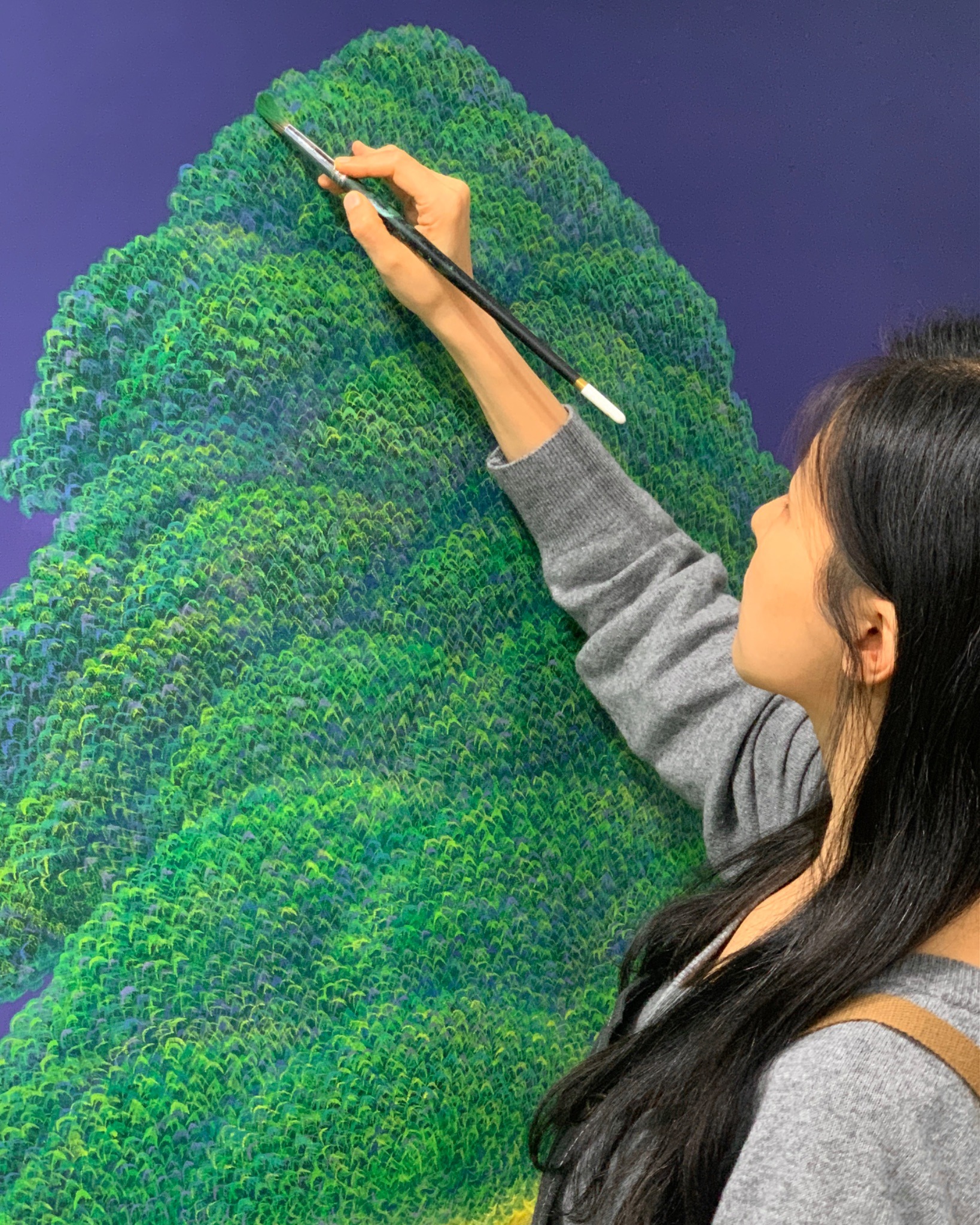 Exploring themes of art for wellbeing, artist Mulgil Kim paints her new artwork in studio.
