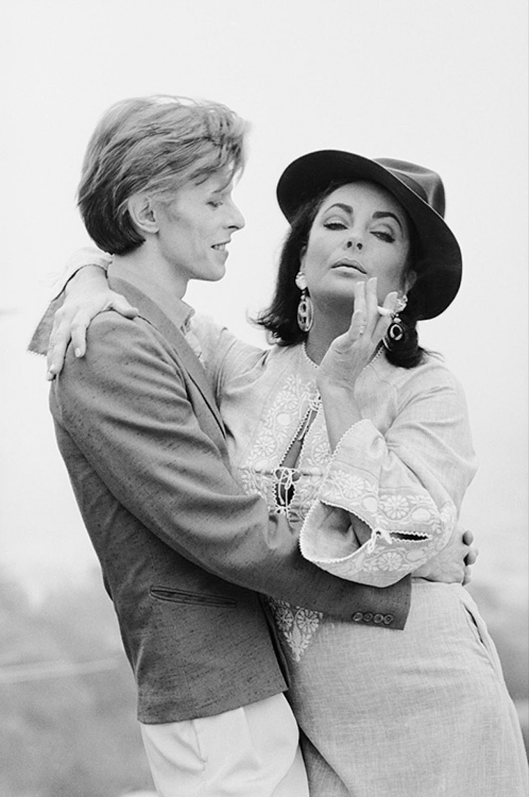 Portrait photographer Terry O'Neill captured David Bowie with Elizabeth Taylor (1975), in his fine art photography portraits.
